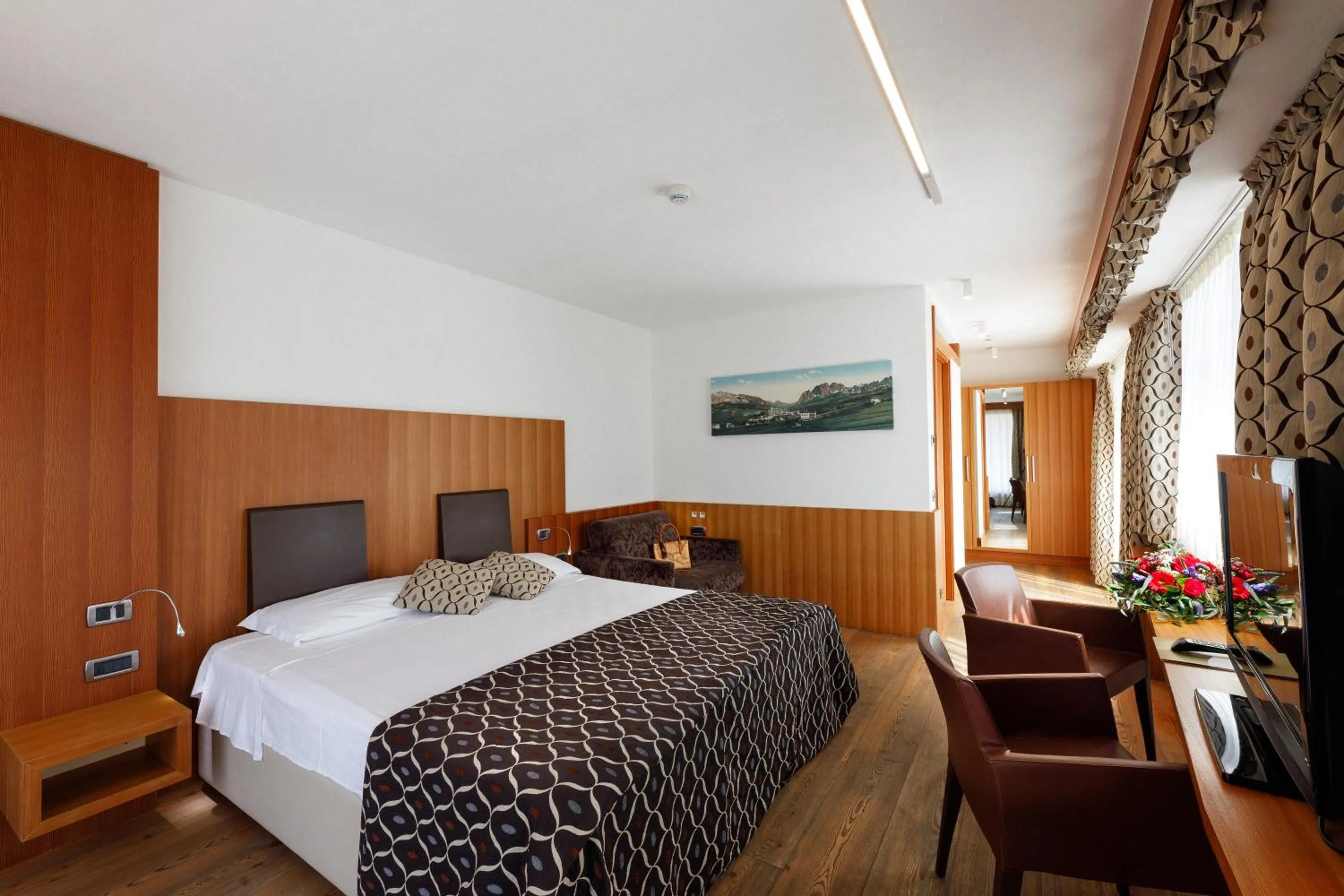 Superior Triple Room with Mountain view in Hotel Alaska Cortina