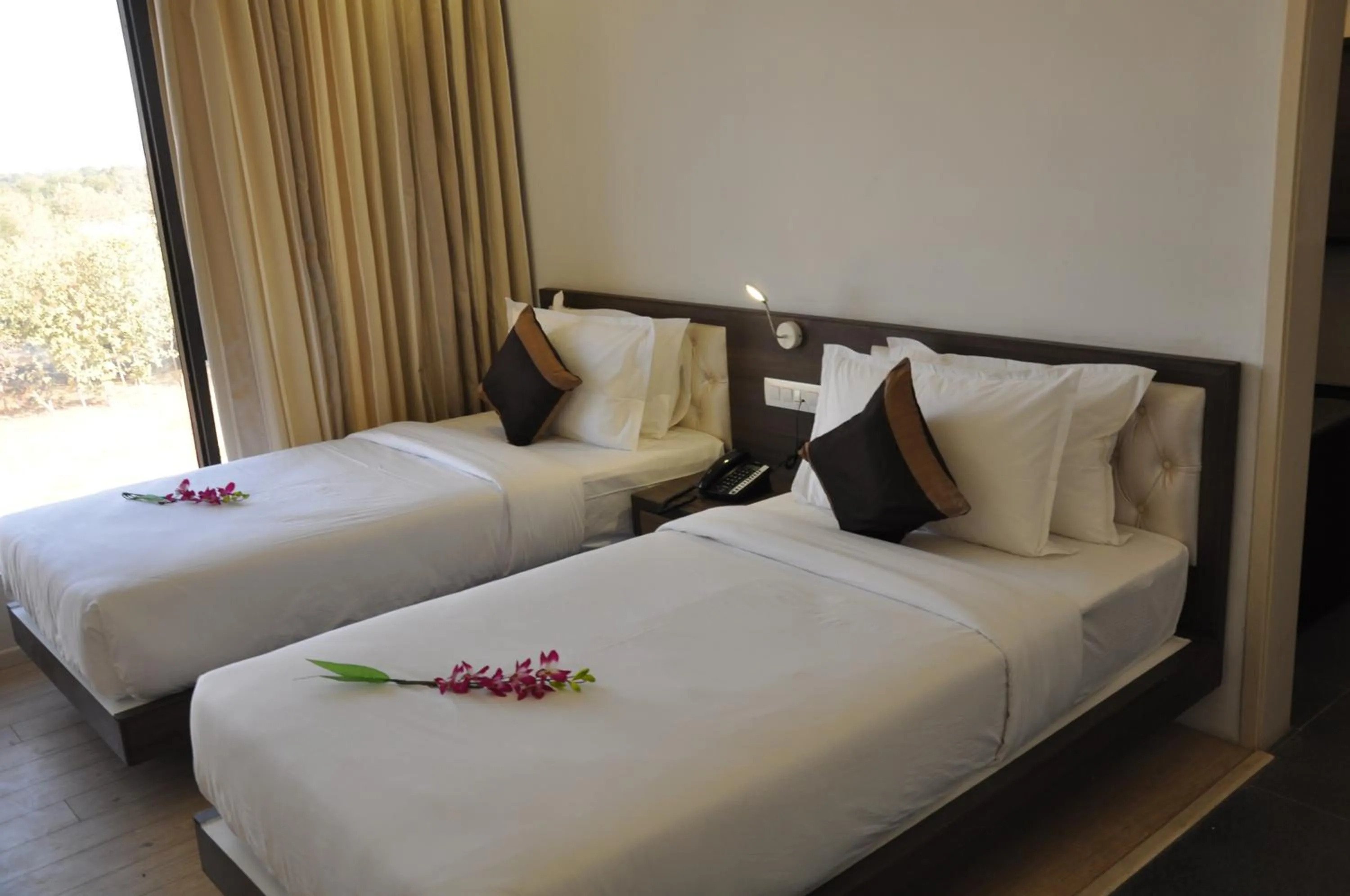 Deluxe Double or Twin Room in Pride Biznotel Manjusar Vadodara Near Sokhda Lake