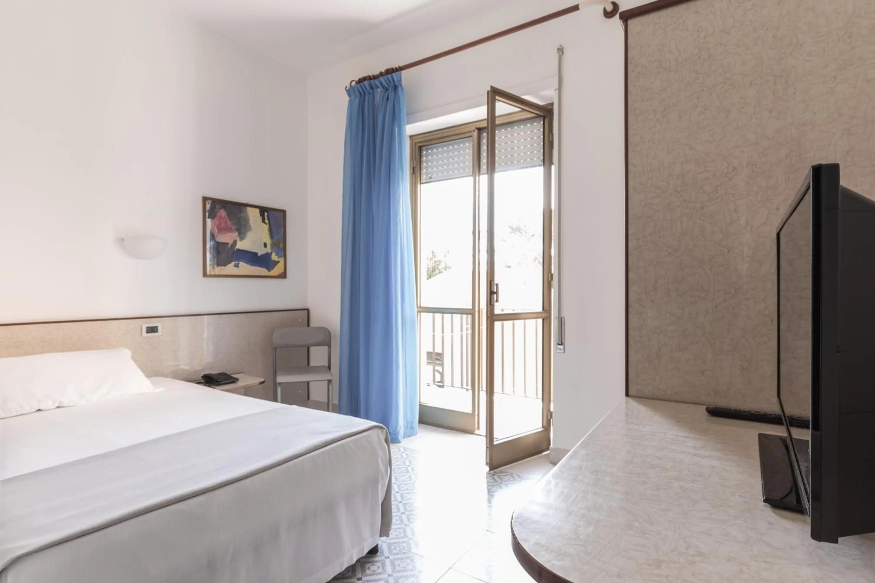 Bed in Hotel Serapo