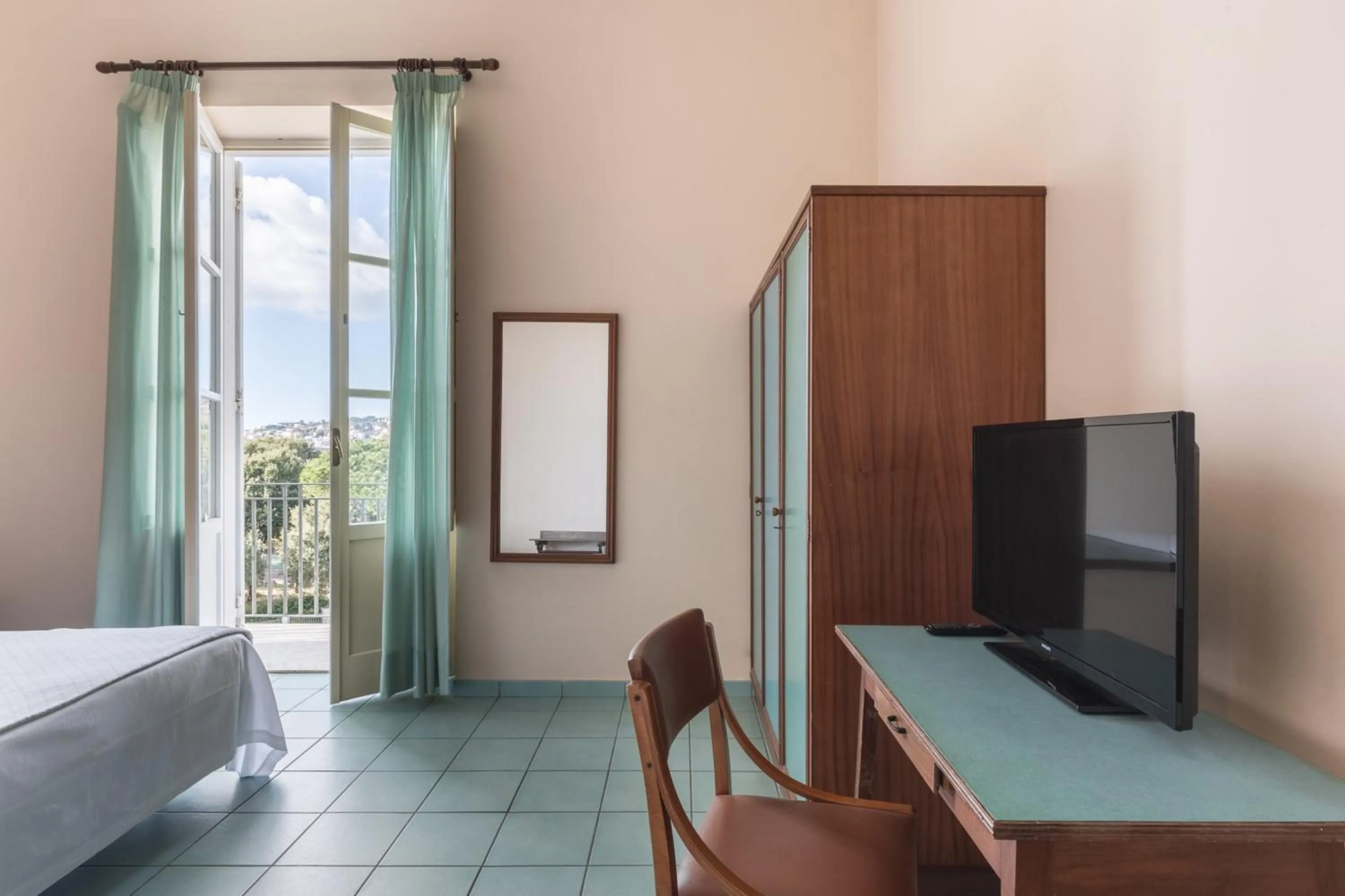 Bed in Hotel Serapo