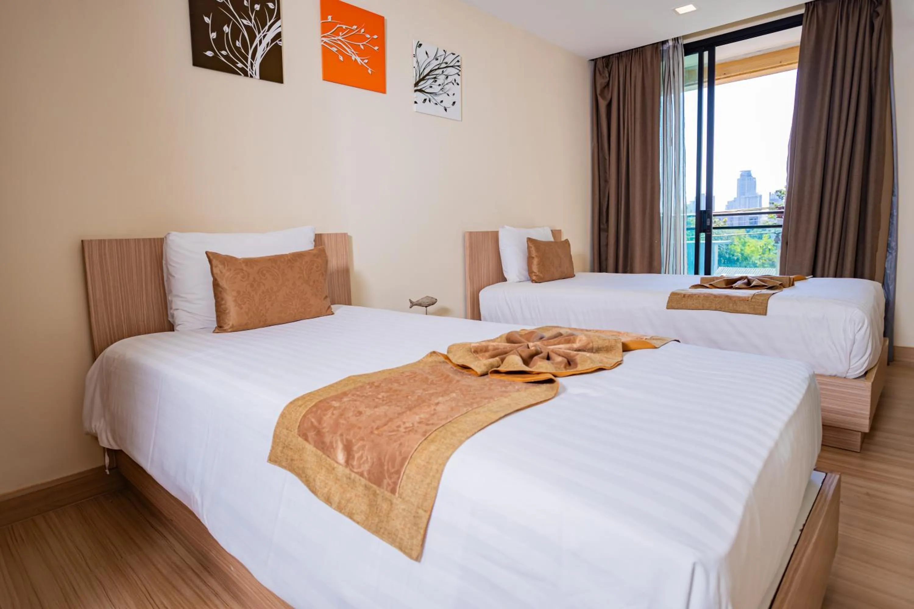 Two-Bedroom Grand Premier King Room with Two King Beds in Ramada by Wyndham Bangkok Ten Ekamai Residences