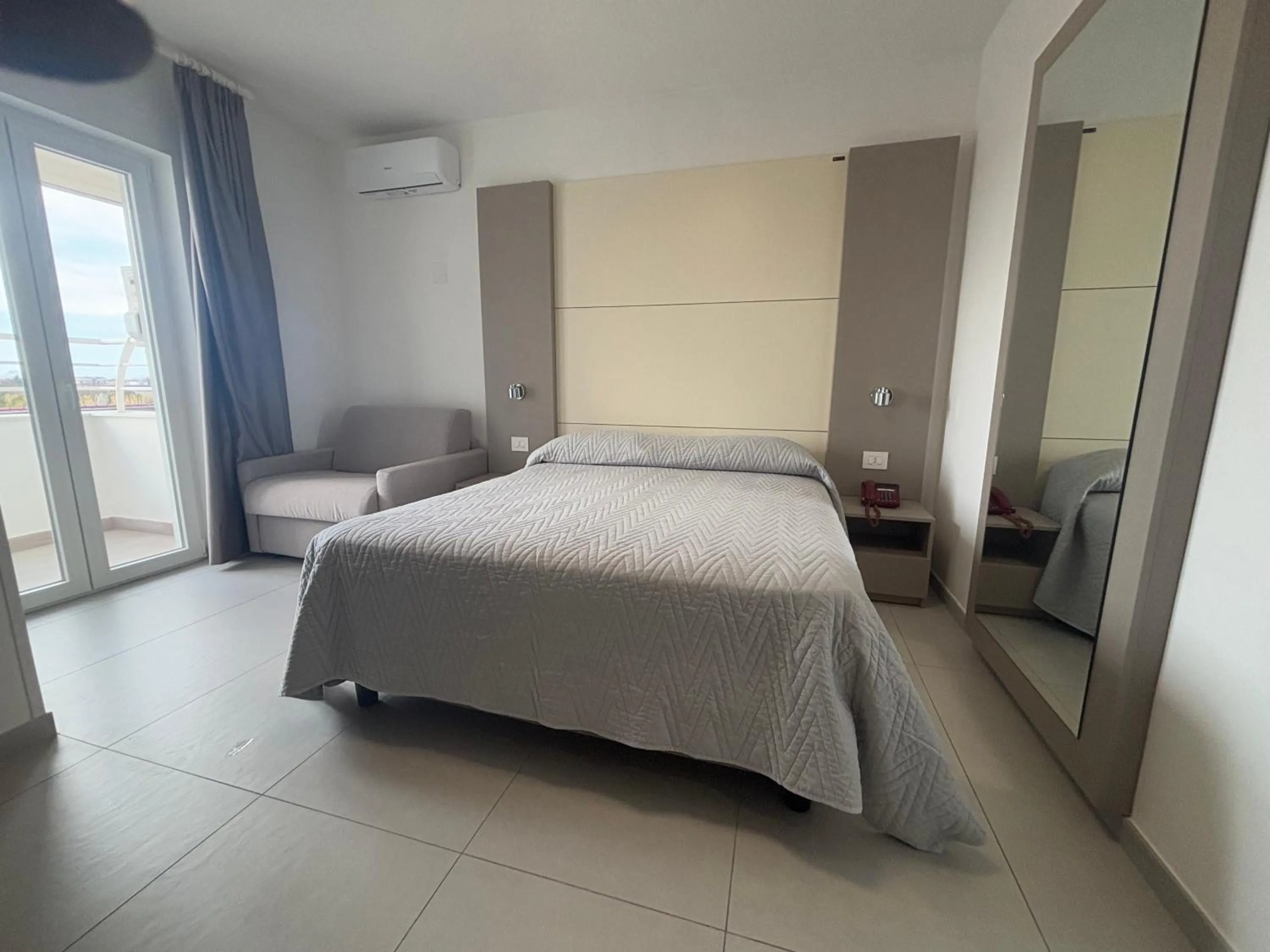 Deluxe Quadruple Room in Hotel La Mela