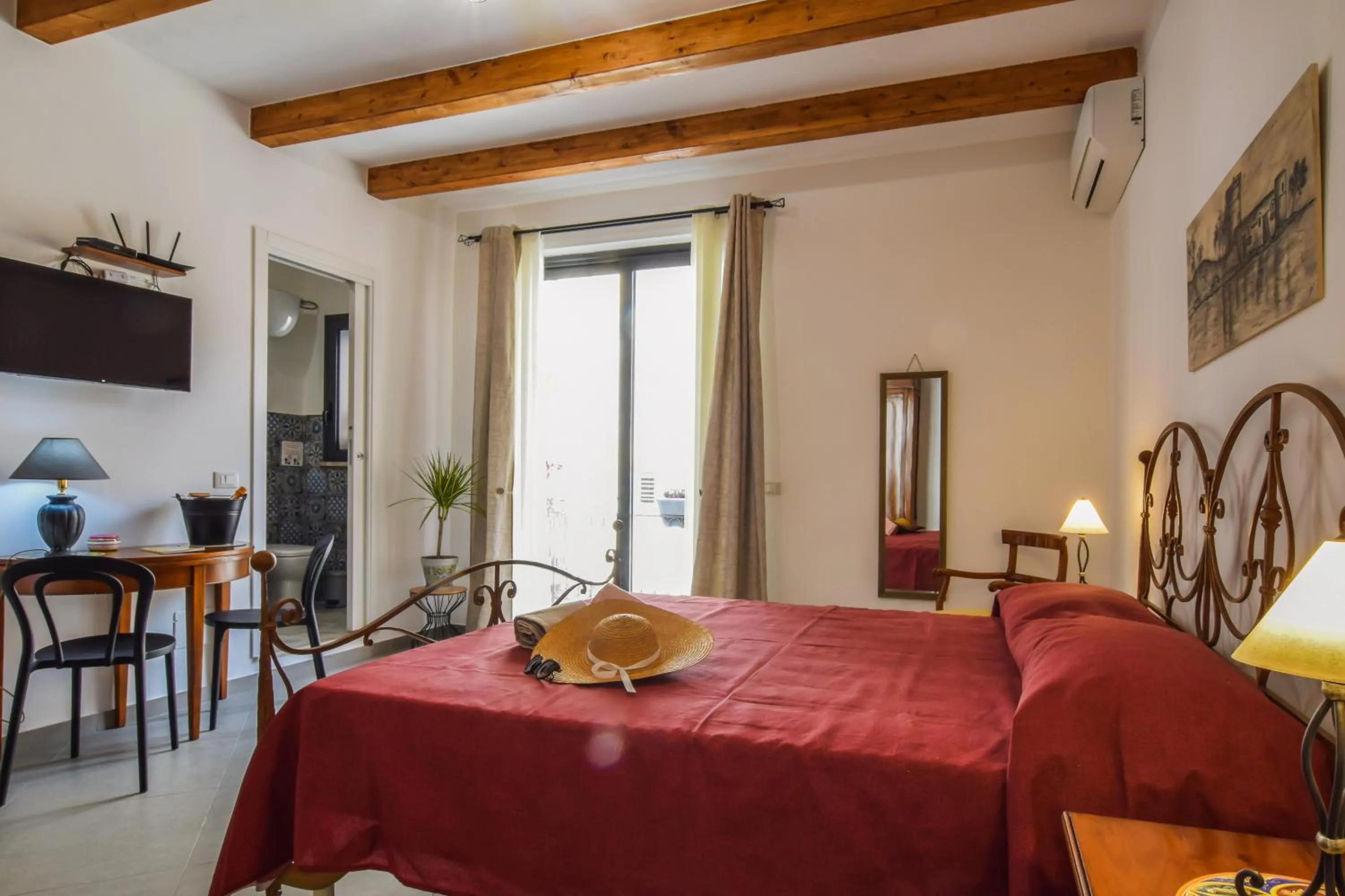 Double Room with Balcony (2 Adults + 1 Child) in AMUNI' Apartments