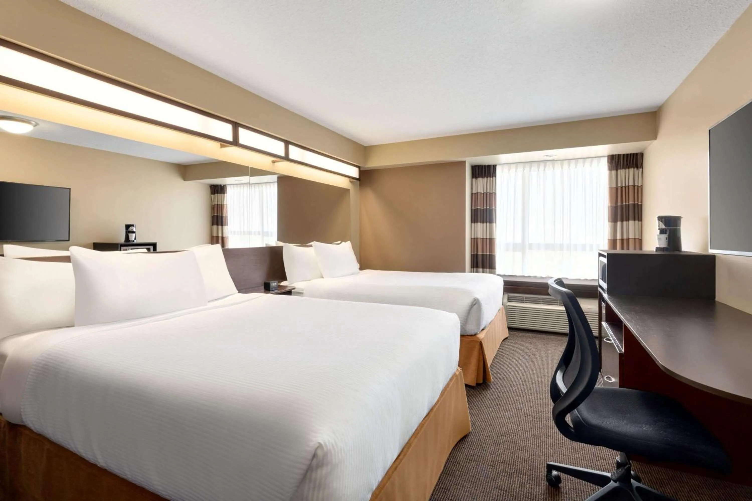 Deluxe Queen Room with Two Queen Beds - Non-Smoking in Microtel Inn and Suites by Wyndham Weyburn