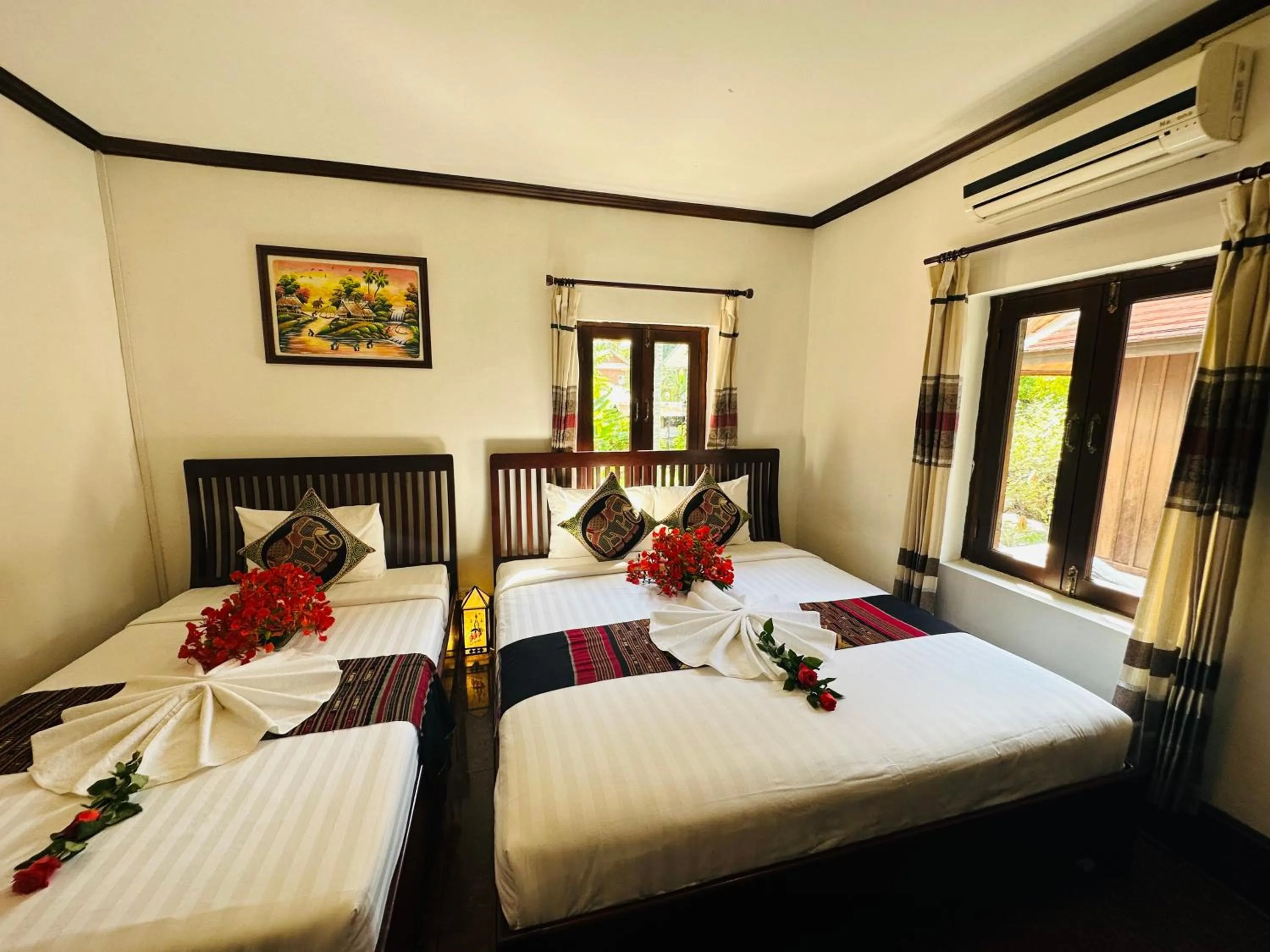 Deluxe Triple Room in Thatsaphone Hotel