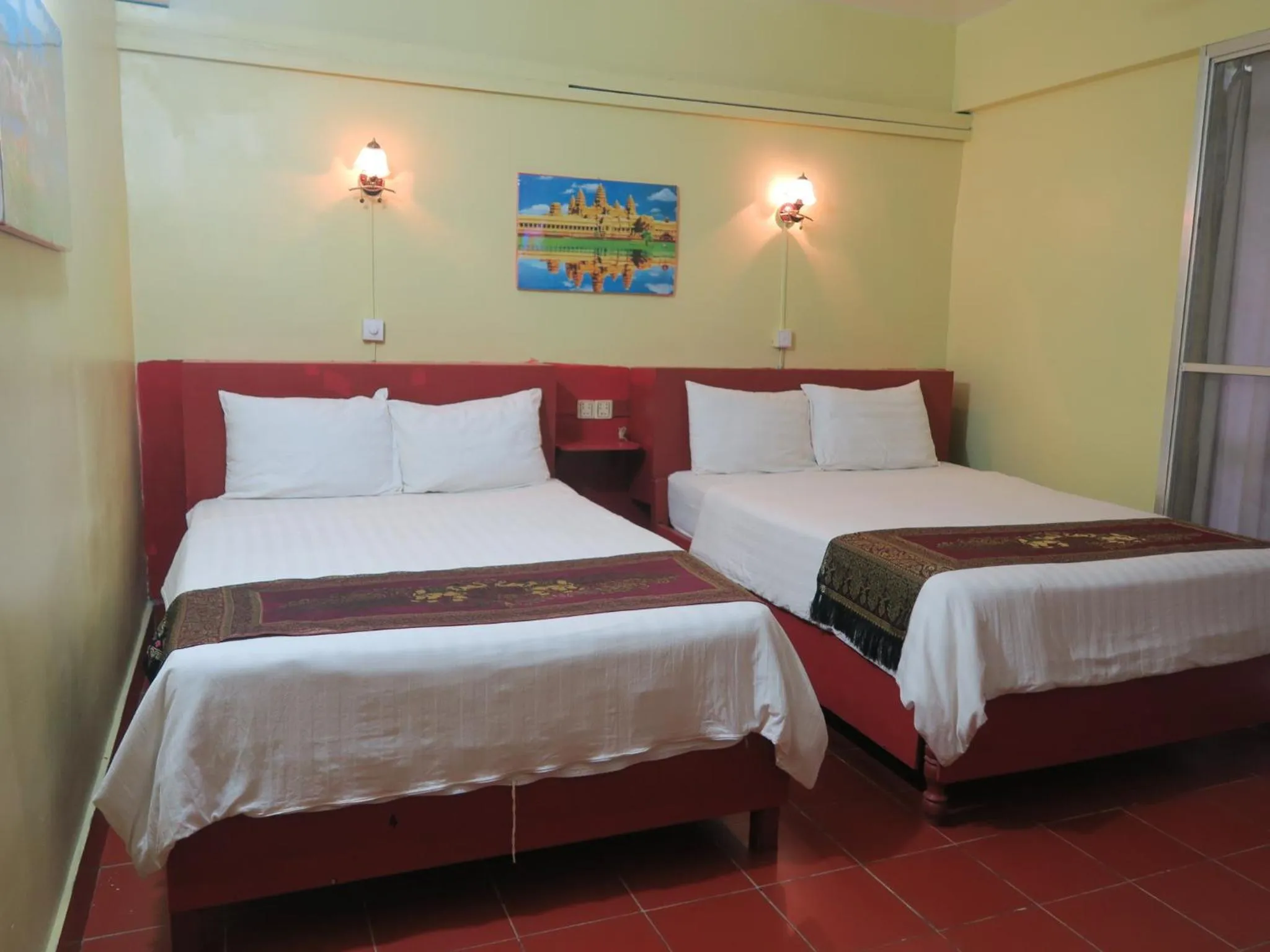 Standard Quadruple Room with Balcony in River Dolphin Hotel