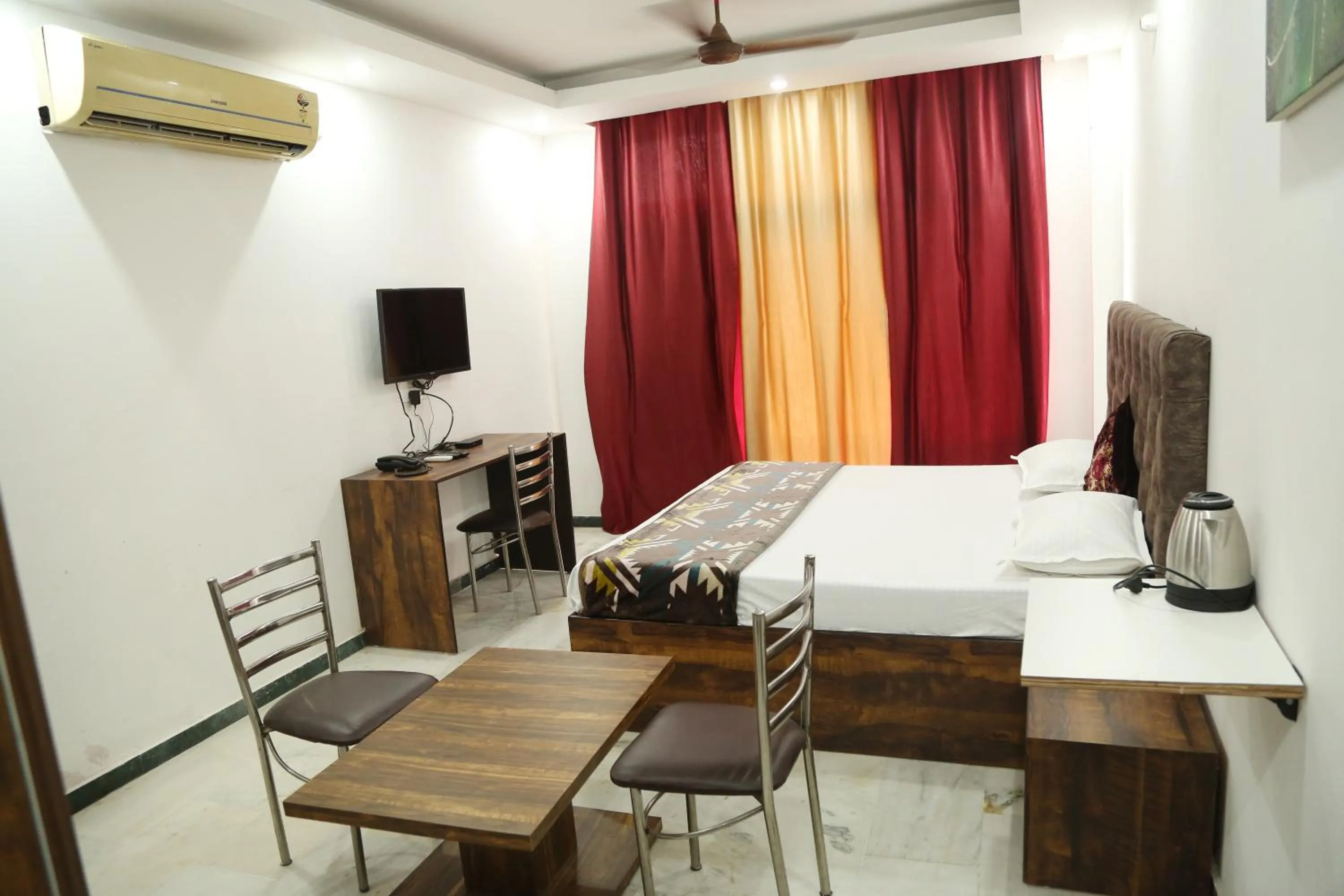 Deluxe Double Room - single occupancy in Shanti Residency