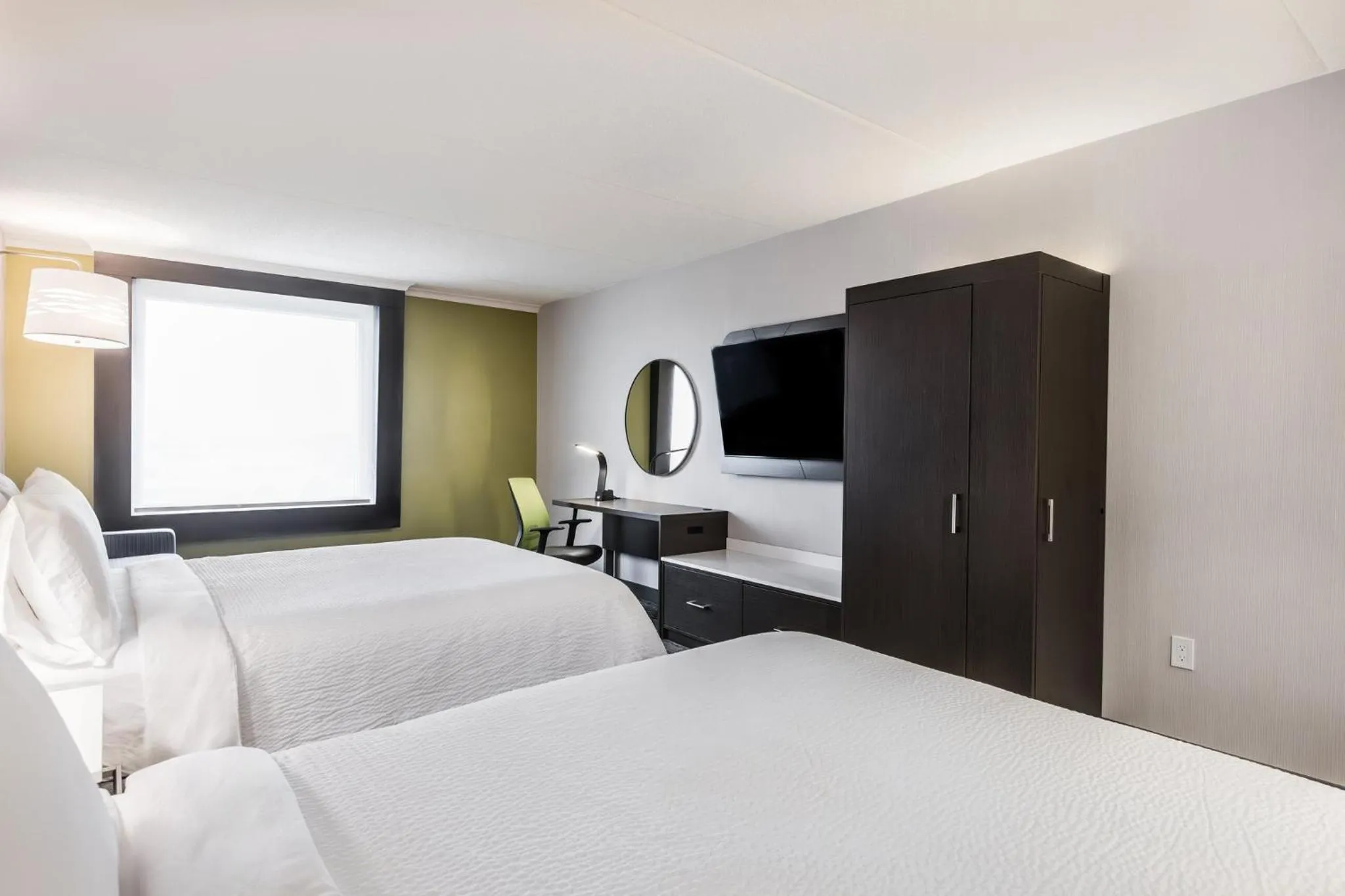 Standard Room with Two Queen Beds and Runway View in Holiday Inn Express & Suites Toronto Airport South by IHG