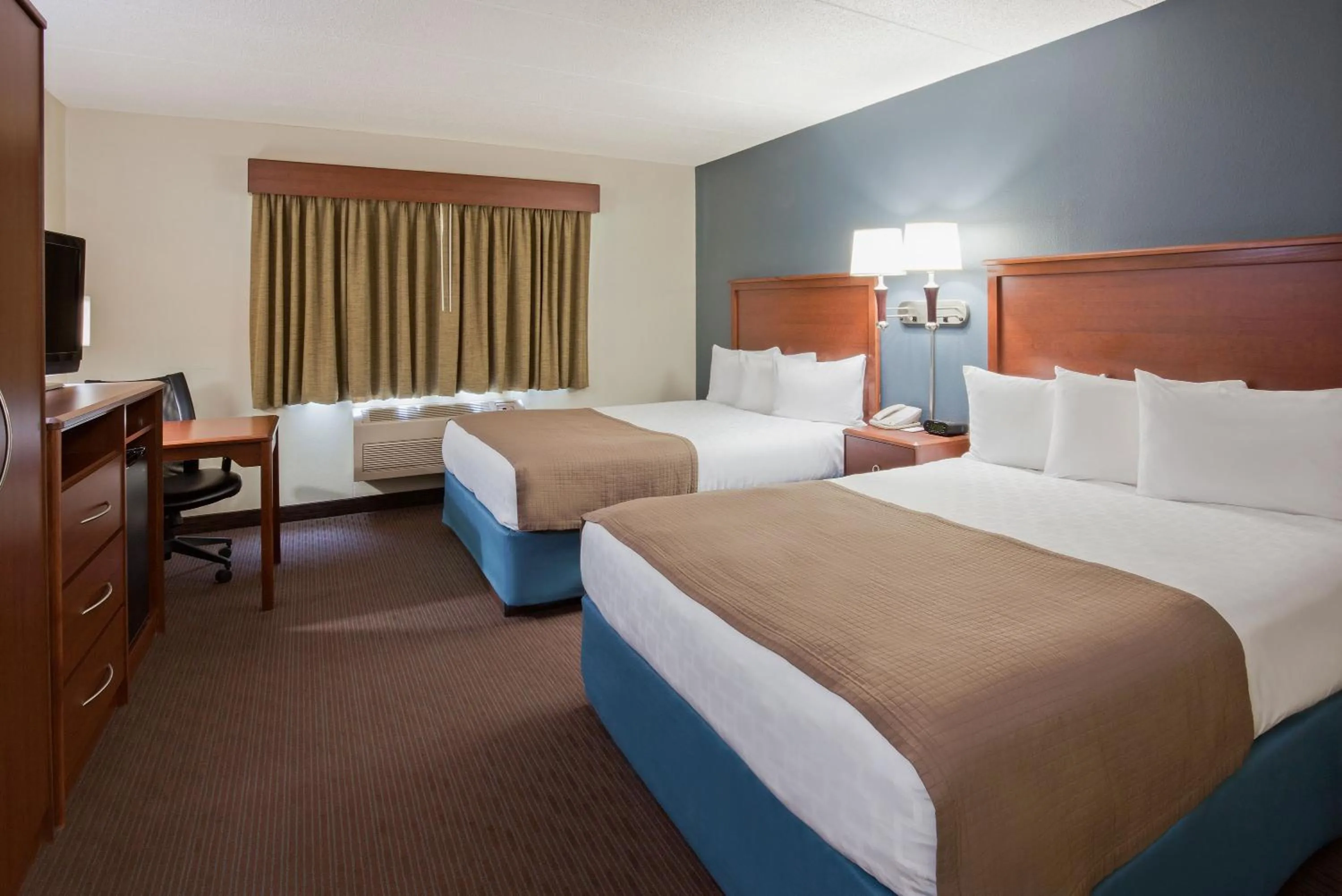 Queen Room with Two Queen Beds - Non-Smoking in AmericInn by Wyndham Spencer