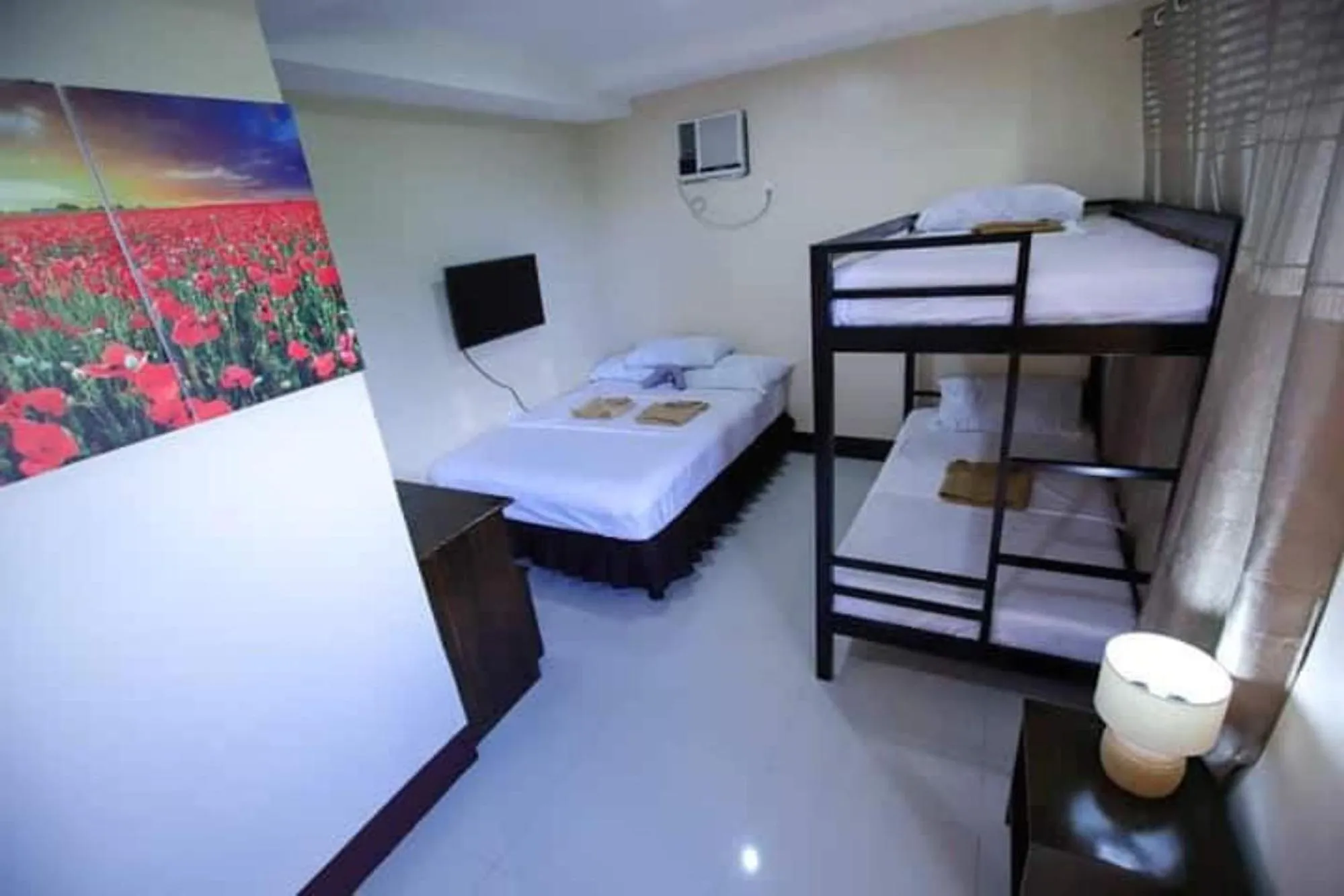 Family Room in Marco s Tourist Inn by RedDoorz