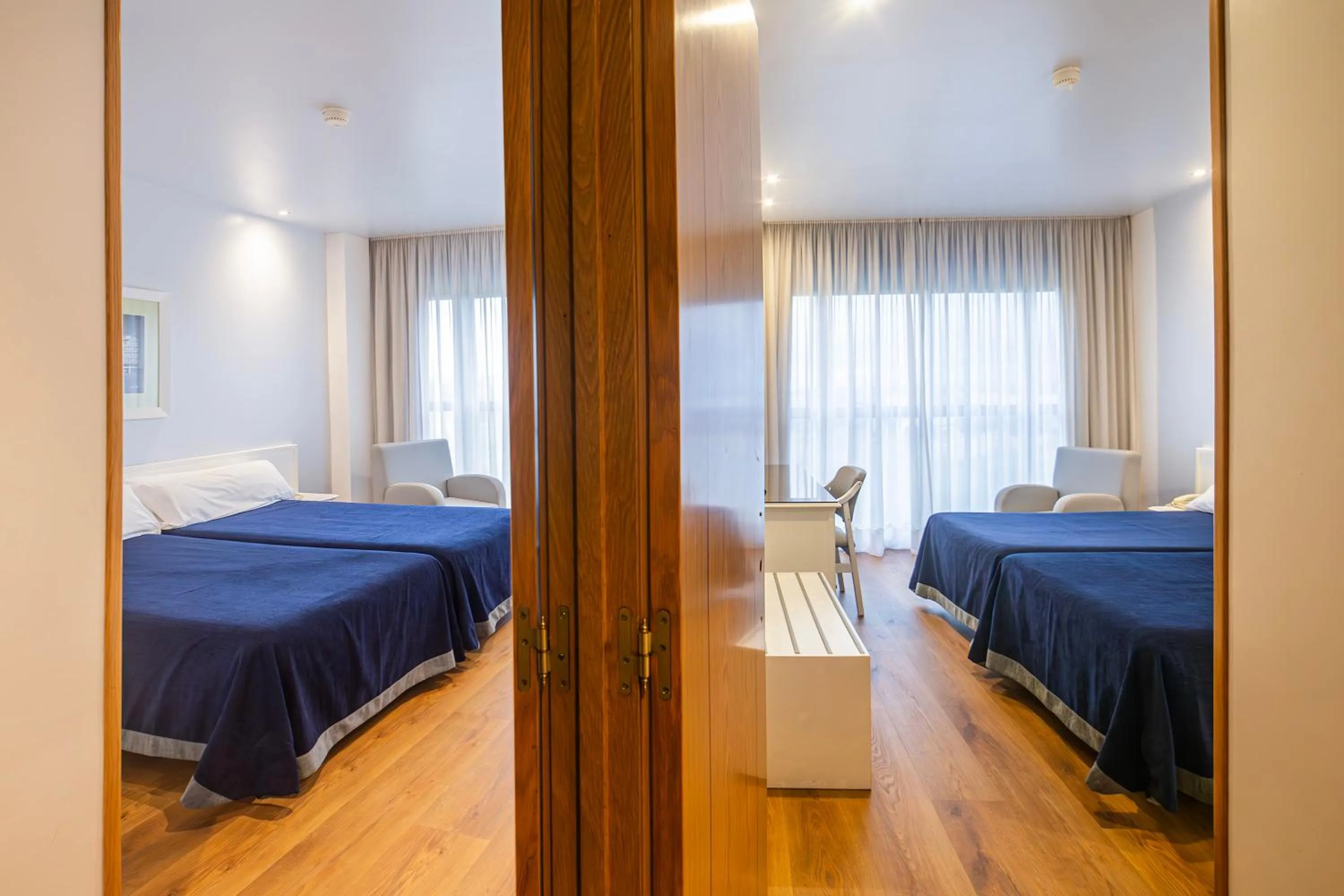 Quadruple Room (2 Adults + 2 Children) in Hotel Auditorio Santiago & Spa