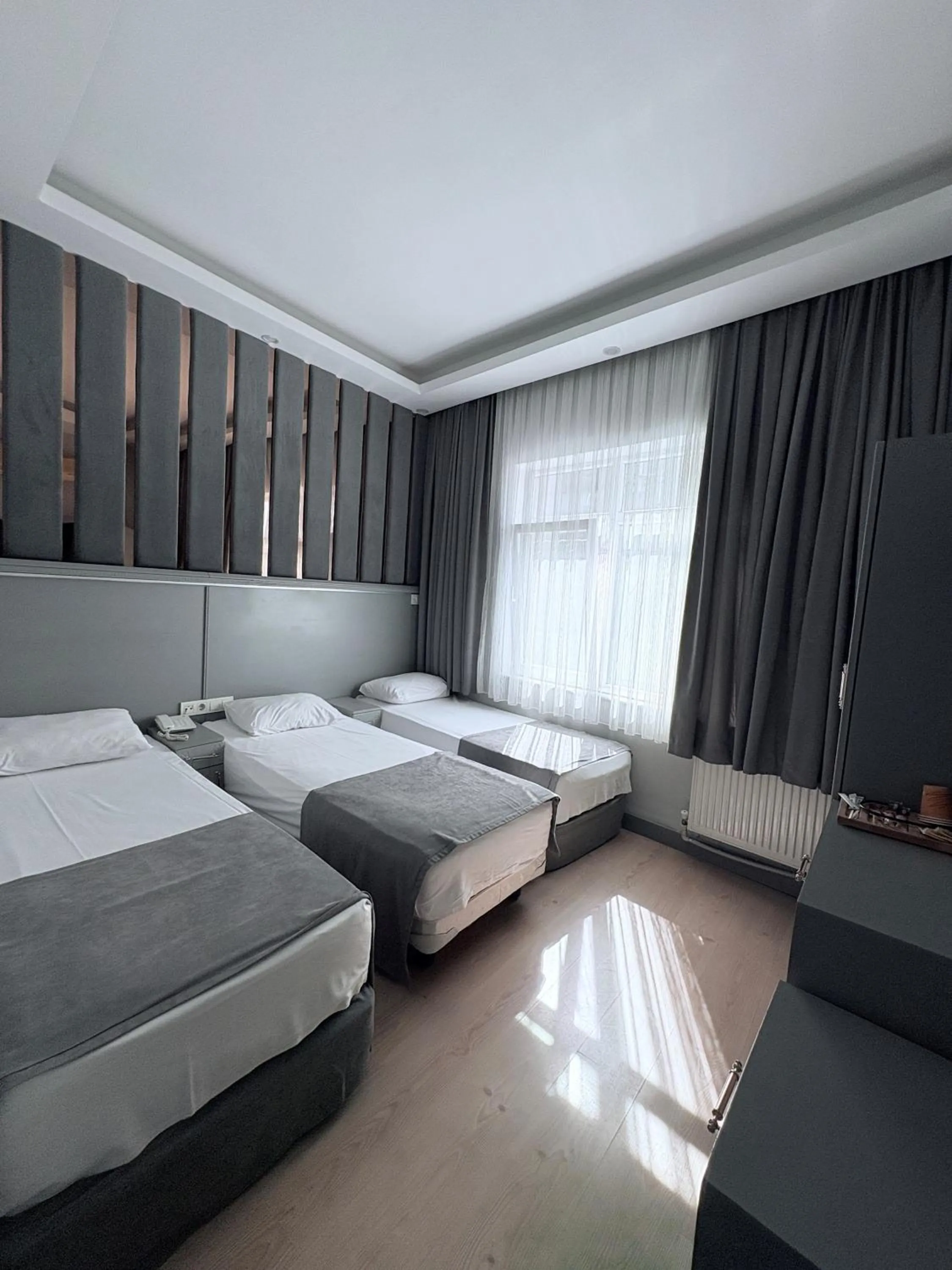Triple Room in Crowned Plus Hotel